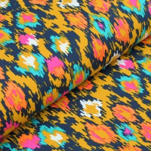 Preisknaller Baumwolljersey ocker mit buntem Ikat Muster