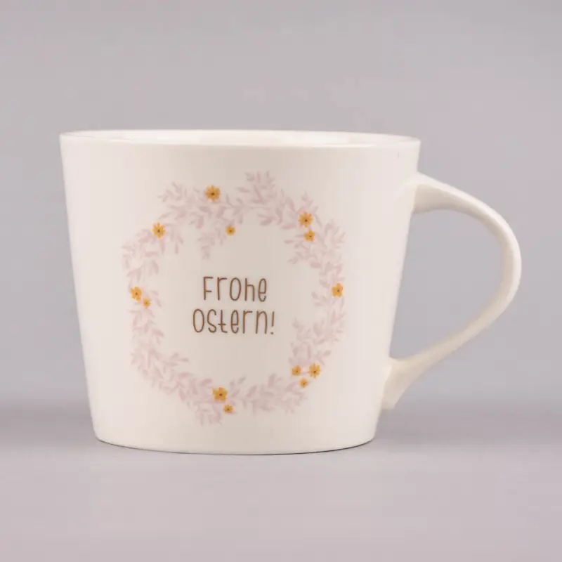 Knallerangebot Grafik Werkstatt Goldtasse Frohe Ostern Blumenkranz weiß pastell goldfarbig 420ml